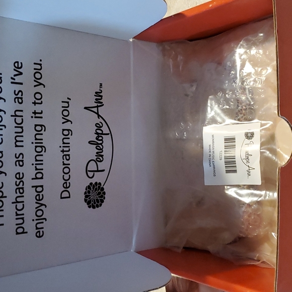 Mombasa Music leopard print earrings from Celebrating Home. 2.5 inches in length - Picture 5 of 6